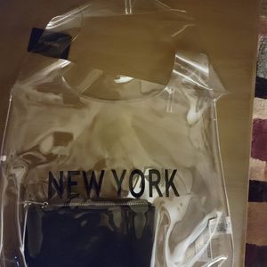 Clear large tote bag with small change purse.